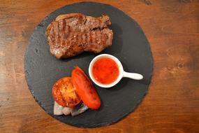 meat with sauce and tomatoes