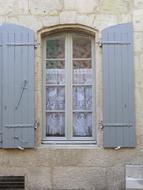 Beautiful French window with grey shutters