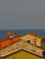 Roofs and Sea and Sky