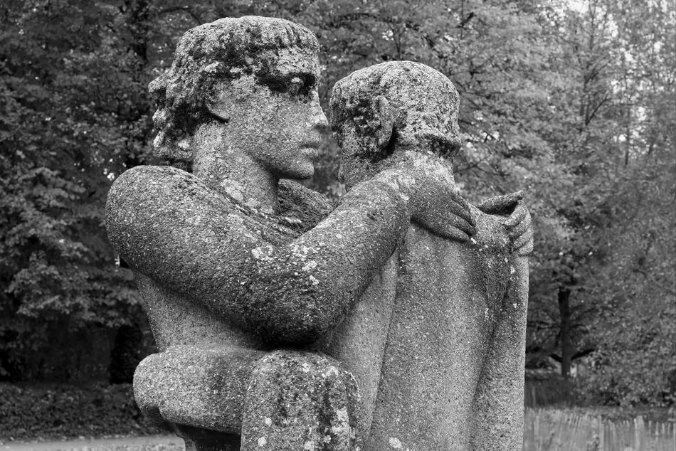The stone sculpture of people is old