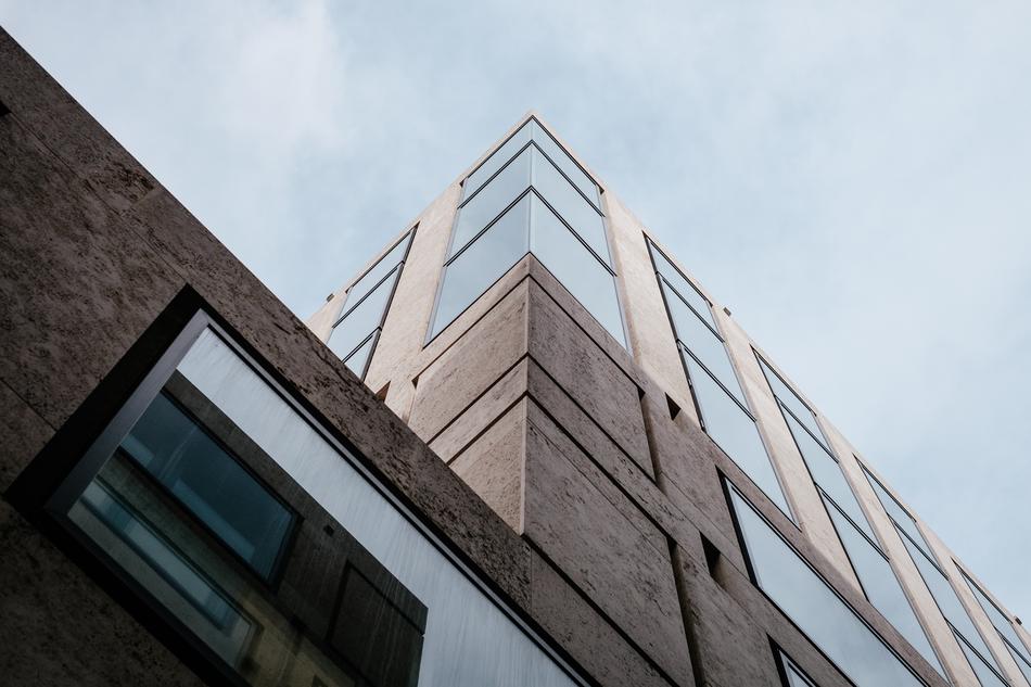 vertical photo of a glass corner of a building
