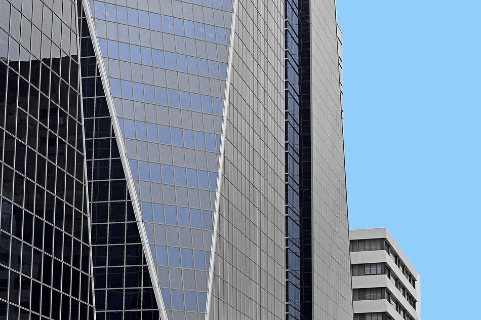 Beautiful skyscrapers with windows, at blue sky on background