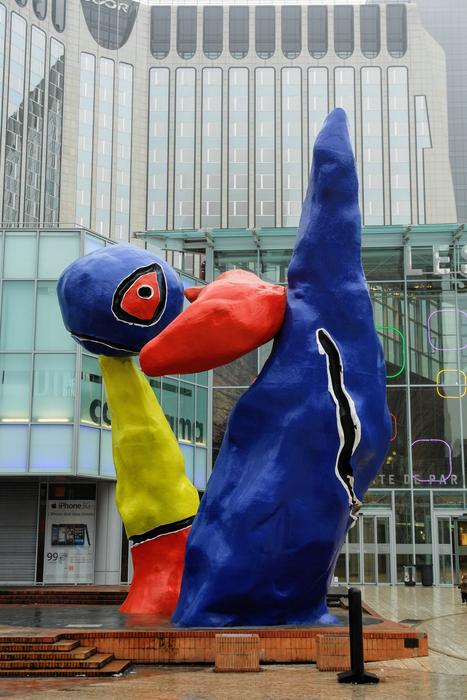 Colorful figure near the facade of the building in Paris, France