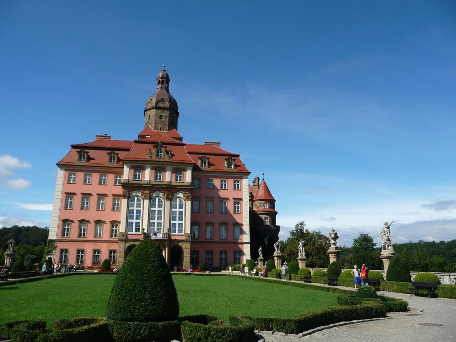 a large building on the background of a garden