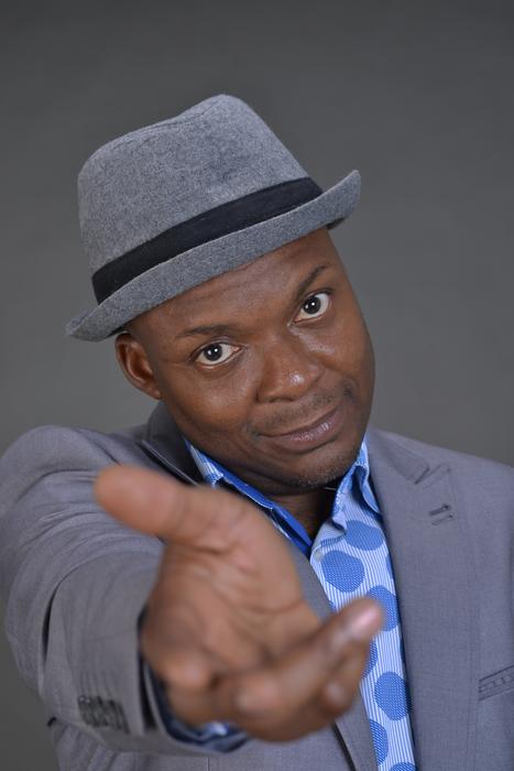man in gray hat with outstretched hand