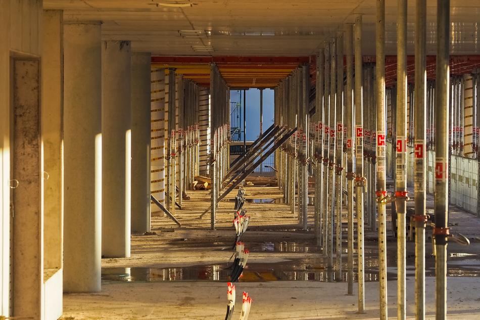Construction side with the water on the floor, in light and shadow