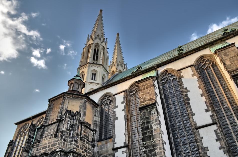 Beautiful and colorful Pfarrkirche St Peter and Paul in Görlitz, Germany, with the steeples, under the blue sky with white clouds