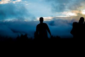 silhouette of a man at dusk