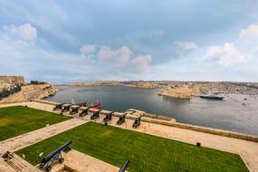 vintage cannons at the port in Valletta, Malta