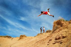 boy jumping from the cliff