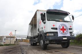 Medical truck on the road, on the Golan Heights, near the colorful plants