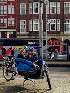 Children in parked Bicycle in city, netherlands, Amsterdam