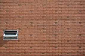 small window in a brick wall