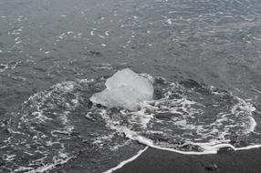 Piece Of Ice On Beach