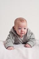 baby in a gray sweatshirt