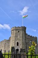 Flag on tower of medieval cardiff castle, uk, wales