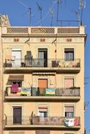 balconies with clothes on a house in barcelona