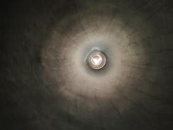 light bulb on the ceiling in a dark room