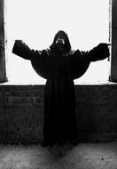 black and white photo of a girl in a black hoodie