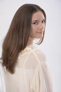 photo of a young girl in a white blouse