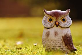 Owl figure, garden decor on lawn