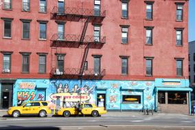 parked taxis at a red building in New York