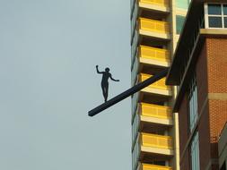 art of human silhouette near the building in Evanston