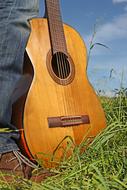 guitar on the green field