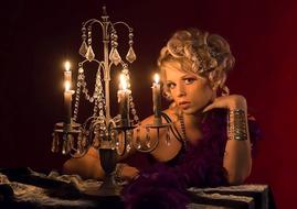 blonde girl near a candle