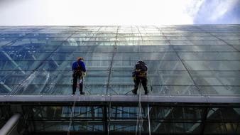 Window Cleaners at work on glass facade, germany, Hamburg