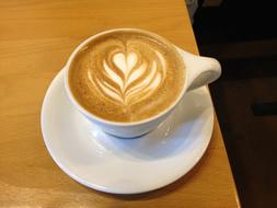 Milk hot drink with a pattern