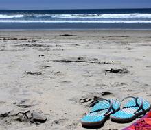 blue slippers on the beach