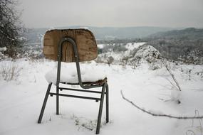 Chair Lonely on snowy hill
