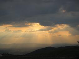 Clouds Light Beam over Mountains