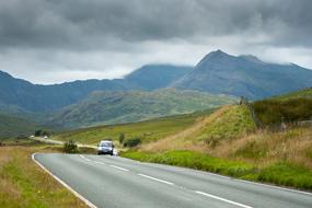 green meadows with a car