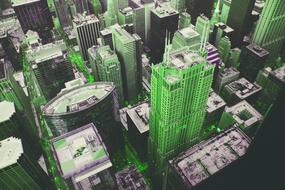 green skyscrapers in the metropolis