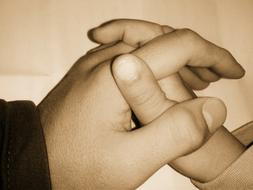 holding hands of a child and parent