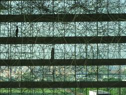 walking people on path along glass facade, singapore, marina bay sand