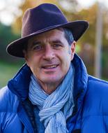 Portrait of mature man in fedora and scarf