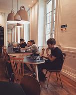 people relaxing in a coffee shop