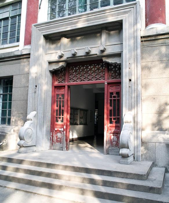 Beautiful, red door of the Chinese school, with decorations