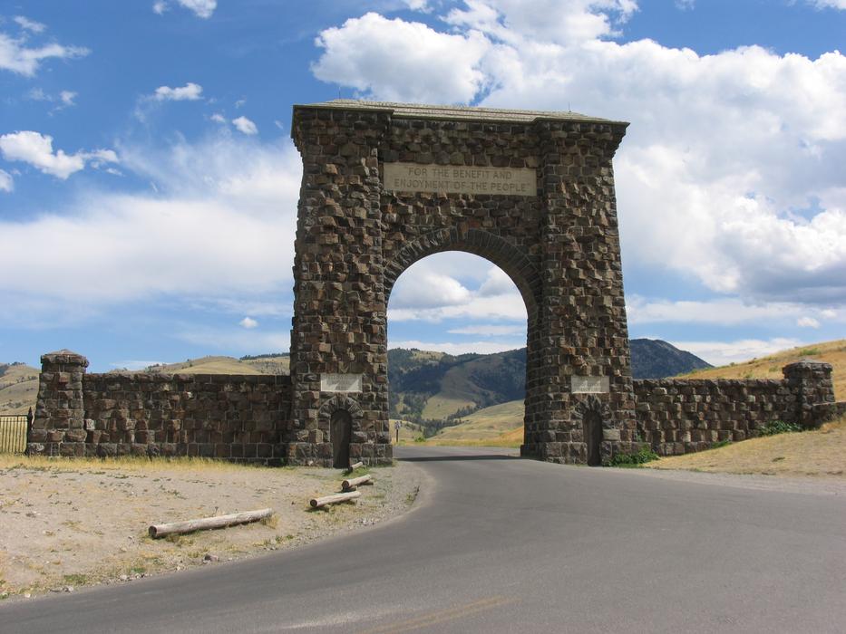 Beautiful Roosevelt Gate monument, on the colorful landscape if Yellowstone, USA