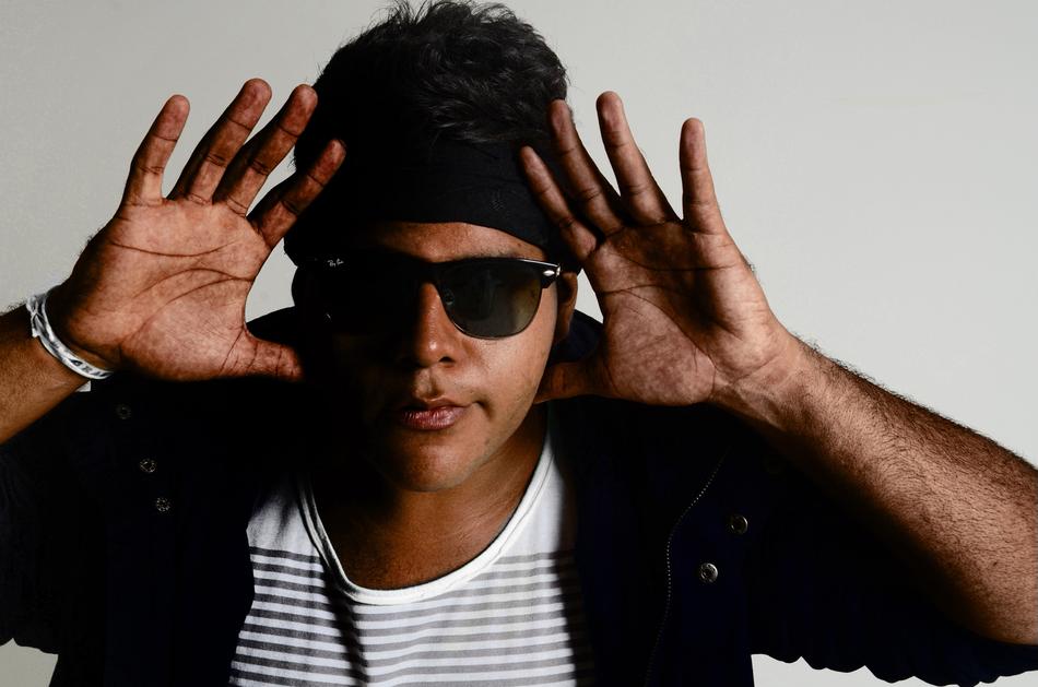 Portrait of Cazuza singer with open hands, in sunglasses