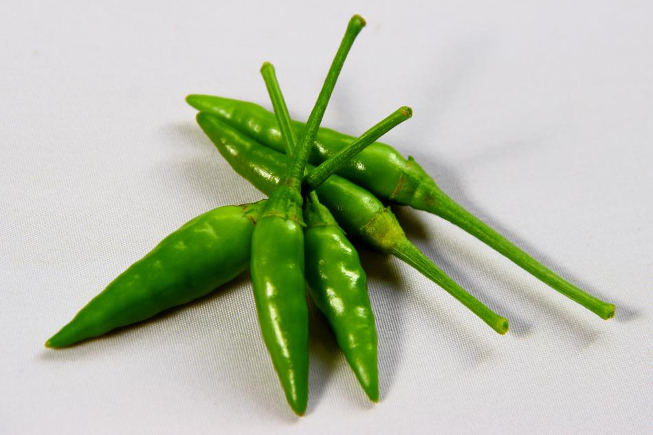 green hot peppers on the table
