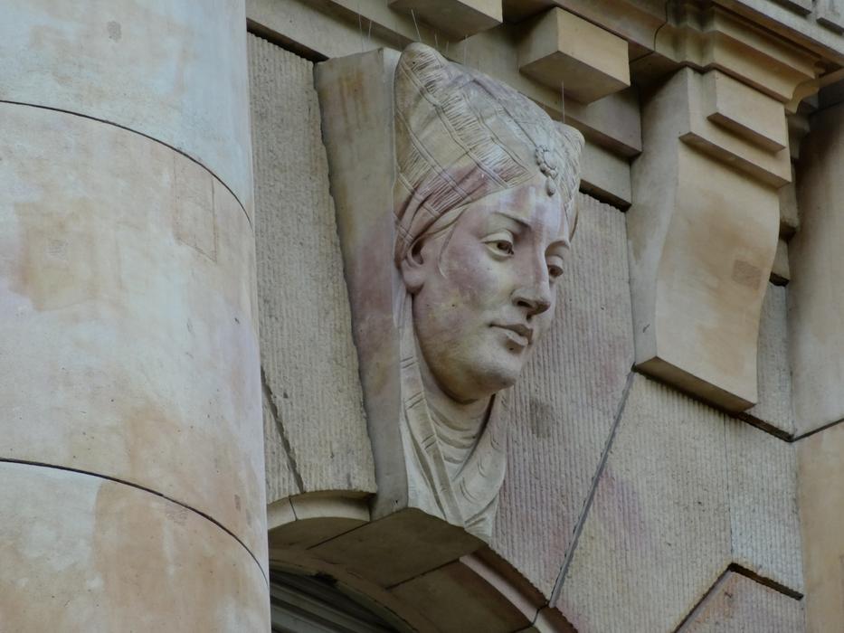 head sculpture on the facade in budapest