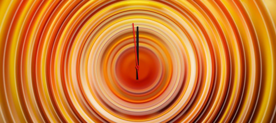 orange abstract clockface with pointers at twelve