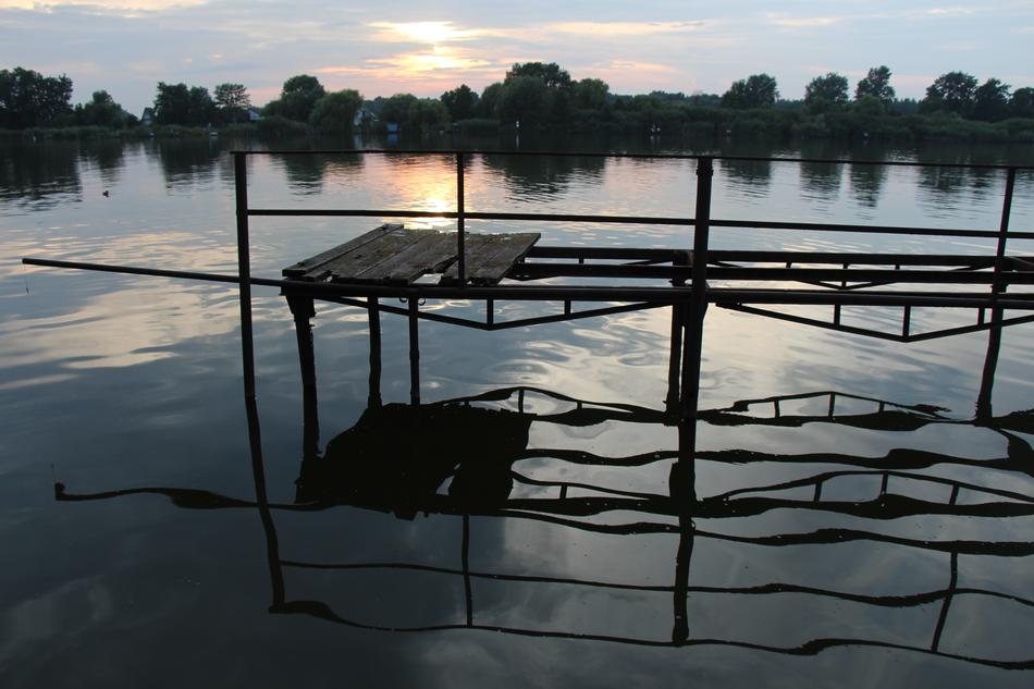 metal bridge by the lake