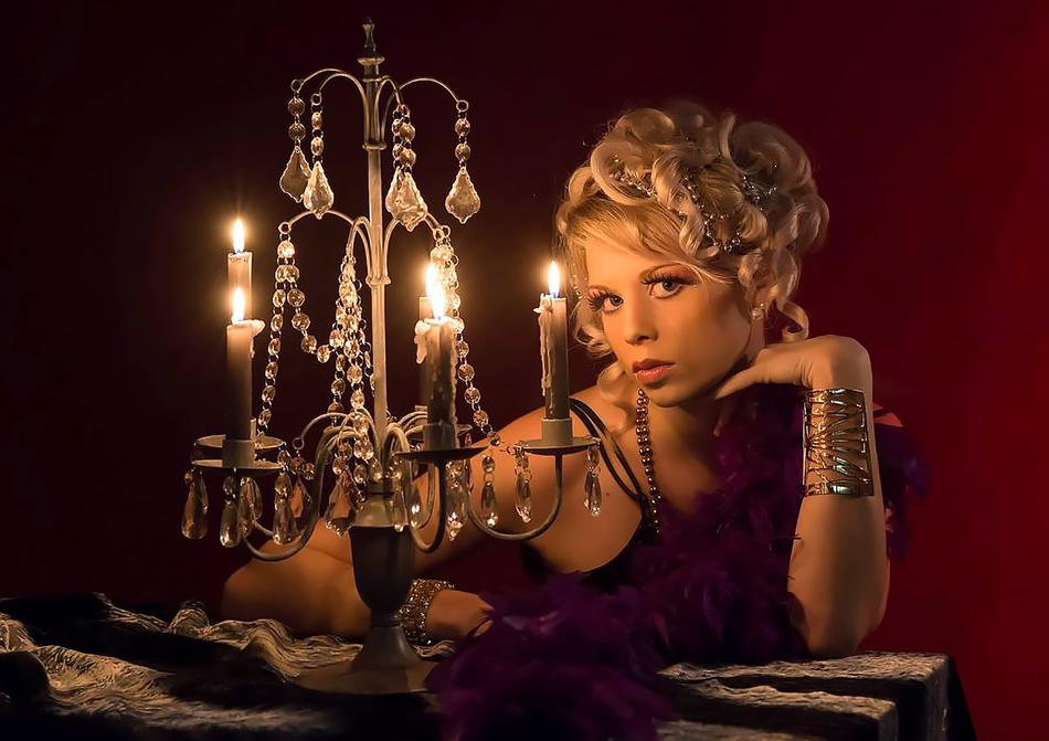 blonde girl near a candle