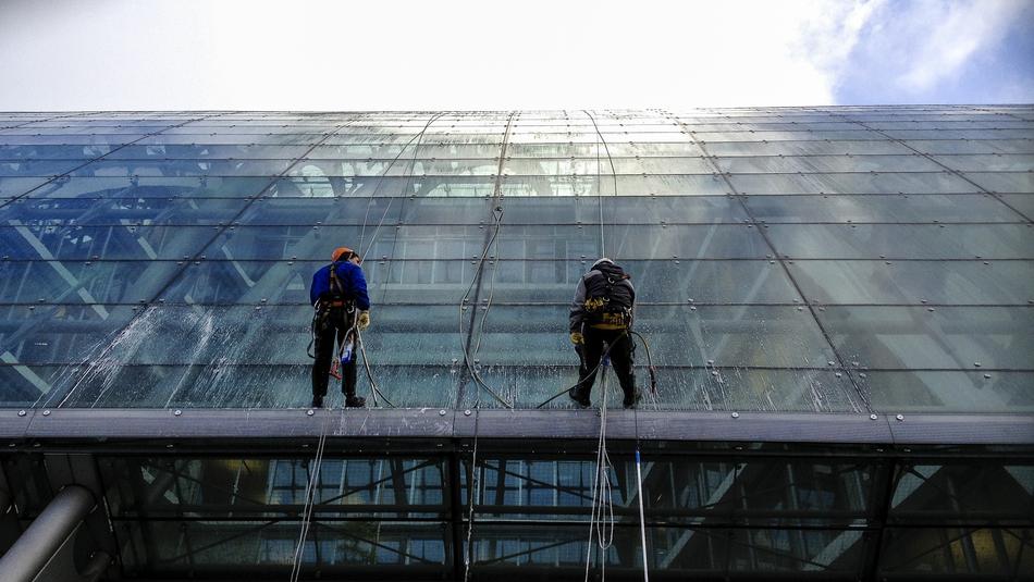 Window Cleaners at work on glass facade, germany, Hamburg