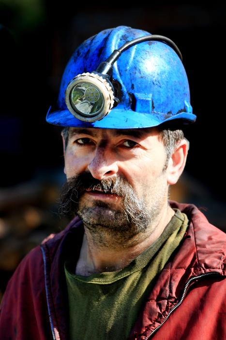 Miner in blue helmet, with the light, in Zonguldak, Turkey